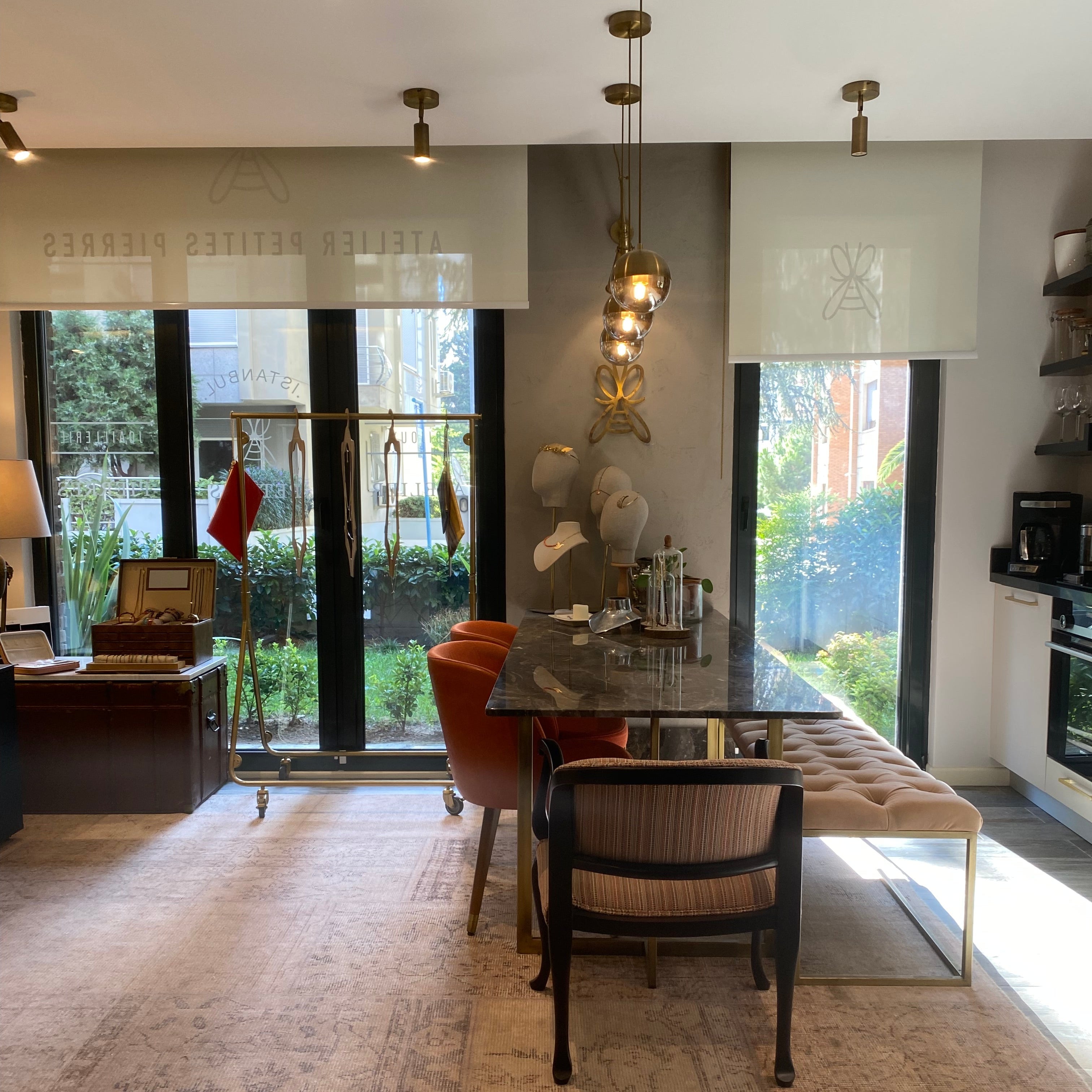 Modern interior with a glass table and chairs near a large window.